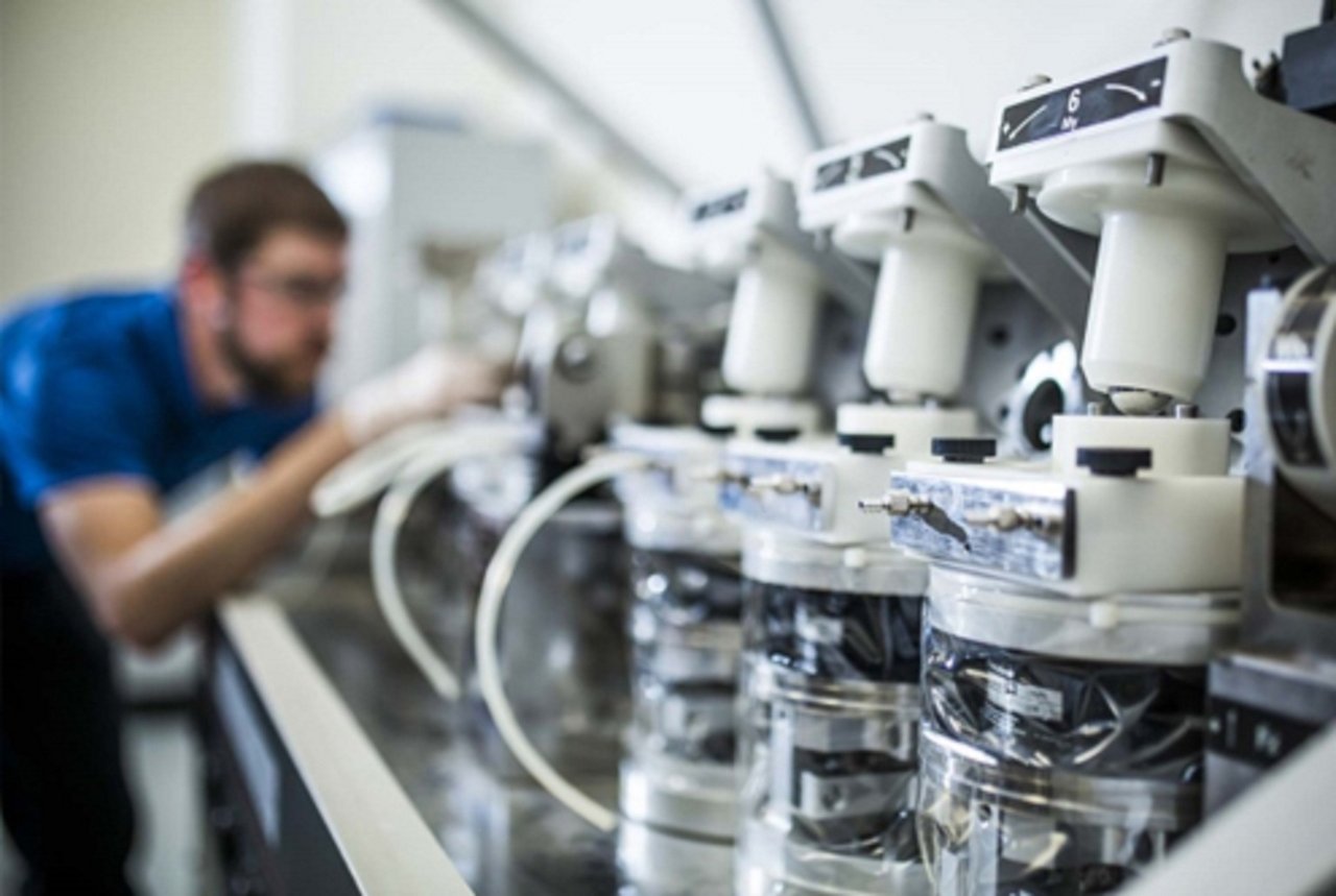 Analysers and sample handling equipment on a clinical laboratory bench